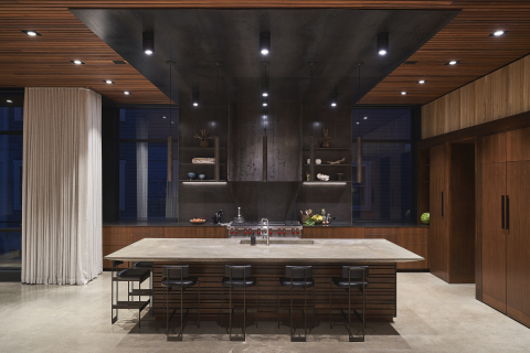 Stunning, architectural cast-in-place concrete kitchen island. (Photo Credit: Michael Blevins)