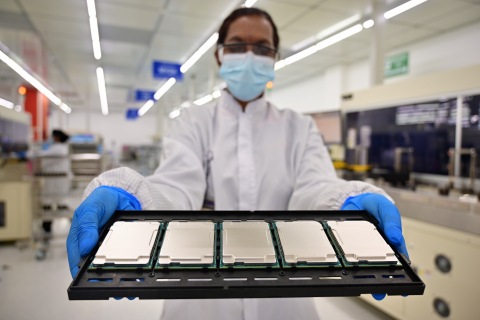 Intel manufacturing technicians in Kulim, Malaysia, display 3rd Gen Intel Xeon Scalable processors during their production cycle. Intel introduces the 3rd Gen Intel Xeon Scalable processors (code-named "Ice Lake") and the full platform that they join on Tuesday, April 6, 2021. (Credit: Jason Cheah/Intel Corporation)
