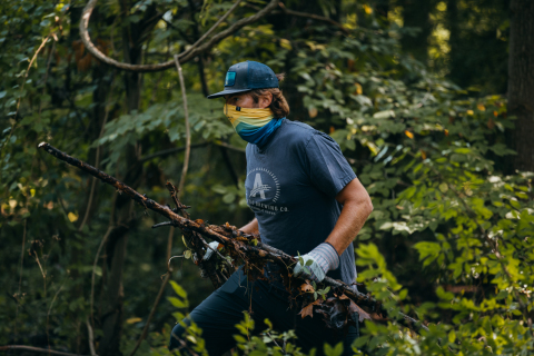 Athletic Brewing Company volunteer at a trail clean-up for the Two For The Trails program. (Photo: Business Wire)