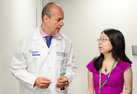 original Alex C. Spyropoulos, MD, professor at the Feinstein Institutes speaks with a colleague. (Credit: The Feinstein Institutes for Medical Research)