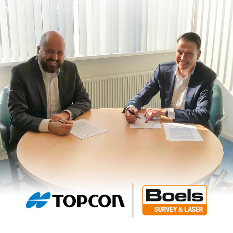 Guido Elzenaar (left) from Topcon and Robbert Willemsen (right) from Boels are shown during the signing of an agreement between the two companies. (Photo: Business Wire)