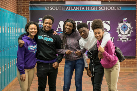 South Atlanta High School students smile and gather, showcasing their school's spirit. South Atlanta High School will begin implementing the comprehensive, evidence-based prevention model BARR (Building Assets, Reducing Risks) with ninth-grade students. NOTE: This photo was captured pre-COVID during the 2018-2019 academic year. Students and staff are required to were masks in all APS buildings. (Photo: Business Wire)