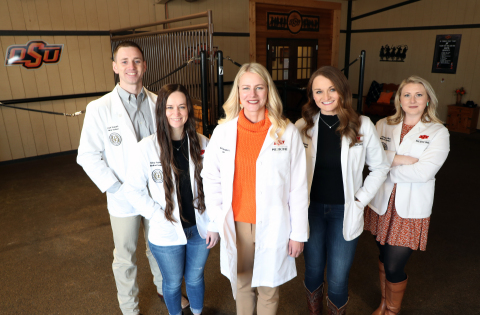 OSU Medicine students with a focus on rural health stand around OSU-CHS President Dr. Kayse Shrum. (Photo: Business Wire)