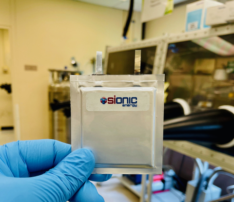 A member of the Sionic Energy team holds one of the company's silicon battery cells, which deliver up to 50% greater energy density, 30% lower cost, and increased safety, and can be integrated into cylindrical, pouch, or prismatic cell formats in existing cell production supply chains and infrastructure. (Photo: Business Wire)