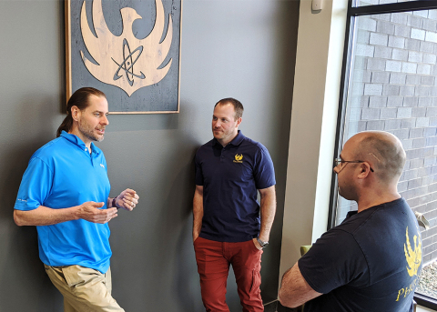 Greg Piefer, CEO of SHINE (left), talks with Evan Sengbusch, general manager of SHINE's Phoenix division, and Ross Radel, chief technology officer and chief operating officer of the Phoenix division, at the Phoenix headquarters and manufacturing center in Fitchburg, Wis., on April 16, 2021. (Photo: SHINE Medical Technologies)