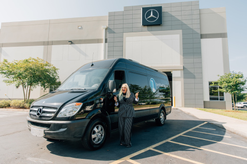 Kim's Open Door founder, Kim Bogart, takes delivery of her organization's Mercedes-Benz Sprinter Passenger Van that was refurbished by Mercedes-Benz USA employees. (Photo: Business Wire)