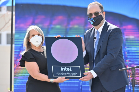 New Mexico Gov. Michelle Lujan Grisham (left) and Keyvan Esfarjani, Intel senior vice president and general manager of Manufacturing and Operations, display a plaque with a processor wafer on Monday, May 3, 2021, at the Intel Campus at Rio Rancho, New Mexico. During a news conference, Intel announced it will invest $3.5 billion in its New Mexico operations in support of advanced semiconductor packaging technologies. (Credit: Walden Kirsch/Intel Corporation)