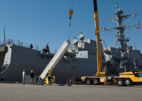 A Vertical Launch System canister is loaded onto a ship. Photo provided by the U.S. Navy. (Photo: Business Wire)