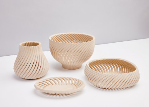 The Vine collection, designed by Yves Béhar and fuseproject, breathes new life into otherwise waste stream-bound wood byproducts, transforming them into elegant home goods. The first-ever collection designed using Forust’s new printing technologies includes a vessel, bowl, basket, and tray. Honoring the warmth and familiarity of the wood material, Vine’s curving, organic forms extrude from a singular point that twists up into a repeating pattern. (Photo: Business Wire)