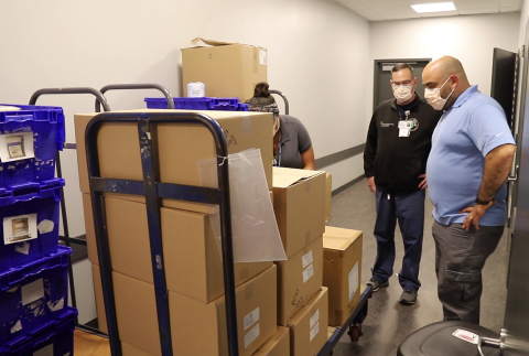 Dr. Eric Cioe-Peña (right), Northwell Health's Director of Global Health, readies supplies for Indian COVID-19 relief mission. Credit Northwell Health.