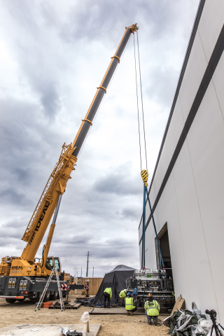 The 24-ton electron beam accelerator is maneuvered into place at NorthStar’s new Accelerator Production facility in Beloit, Wisconsin (Photo: Business Wire)