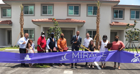 Mayor Matthew A. Pigatt, Brian A. Sidman and David Burstyn gather with city officials for the ribbon cutting of Mirage at Sailboat Cove. (Photo: Business )