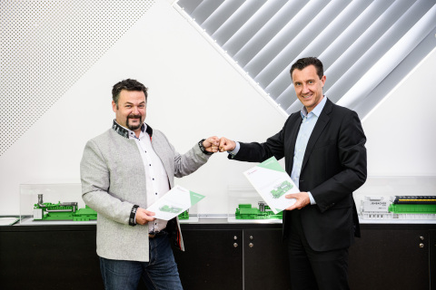 original Marcel Huber, founder and managing director of SynCraft and Carlos Lange, president and CEO of INNIO celebrate their companies’ collaboration (Photo: Business Wire)
