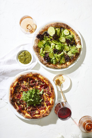 CPK’s new Spicy Honey Bee Pizza and vegan-friendly Avocado Super Green Pizza (Photo: Business Wire)