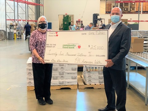 Pennsylvania American Water President Mike Doran presented Greater Pittsburgh Community Food Bank President Lisa Scales with a check for $25,000 today, in support of the Grow Share Thrive campaign. (Photo: Business Wire)