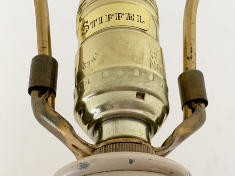 This is a close-up of a late 1960s Stiffel table lamp socket with the brand's vintage logo. Lamps Plus is launching a UGC social media campaign to showcase vintage Stiffel table and floor lamps. Stiffel lighting fixtures are now available exclusively from Lamps Plus. (Photo: Business Wire)