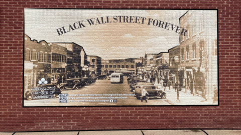 The Black Wall Street mural as painted by the Greenwood Chamber of Commerce near Tulsa, Oklahoma, image captured in June 2021 by Angel Rich. (Photo: Business Wire)