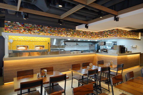 CPK’s signature hearth pizza oven and open kitchen layout give a welcoming feeling and invites guests to sit, enjoy and watch their meals being prepped for a more engaging dining experience. (Photo: Business Wire)