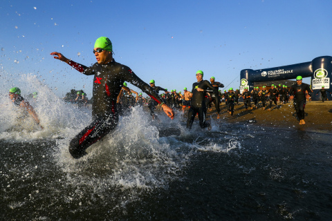 Swimmers enter the water at Boston's Carson Beach at the start of the 2019 Columbia Threadneedle Investments Boston Triathlon. (Photo: Business Wire)