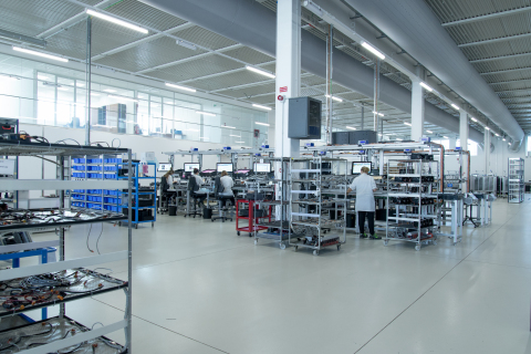 At EXOR’s smart factory in Verona, Italy, factory workers use Internet of Things and artificial intelligence-enabled industrial machines. (Credit: EXOR)