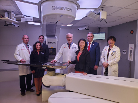 The teams from HCI, U of U and Mevion gather to celebrate the center’s grand opening. Group from left to right: Bill Salter, Ph.D., Senior Director of Radiation Oncology, HCI and Professor and Chief of the Division of Medical Physics, U of U -- Robyn Walker, Sr. Director, Customer Success and Service Operations, Mevion -- James Cooley, Ph.D., Director of Advanced Development, Mevion -- Dennis Shrieve, M.D., Ph.D., Chair in Cancer Research, HCI and Chair of Department of Radiation Oncology, U of U -- Tina Yu, Ph.D., CEO, Mevion -- Michael Good, M.D., Interim President, U of U and Sr. VP for Health Sciences, U of U Health -- Ying Hitchcock, M.D., Professor and Medical Director, Department of Radiation Oncology, U of U. (Photo: Business Wire)