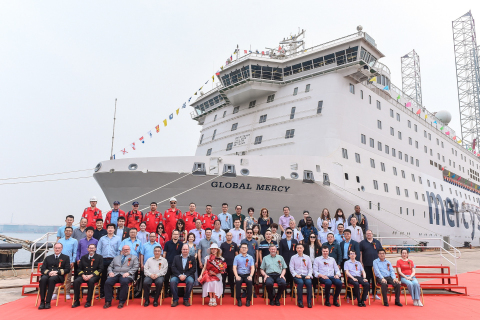 The Global Mercy crew are joined by project management site team and shipyard officials to celebrate the finish of the construction phase and handover to Mercy Ships. (Photo: Business Wire)