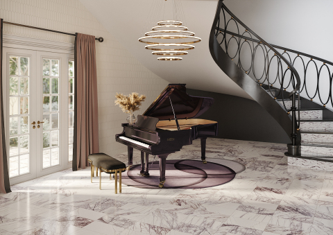 To honor the importance of our 25th anniversary in 2016, we created Masquerade Ball. This collection takes on a modern classic look. White marbles accented with intense veining in lilac hues are intensified with distinctive geometric designs that make a statement. (Photo: Business Wire)