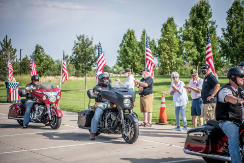 Veteran riders being greeted in town. (Photo: Business Wire)