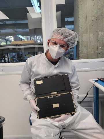 An Astranis engineer holds the Astranis Software-Defined Radio. (Photo: Business Wire)