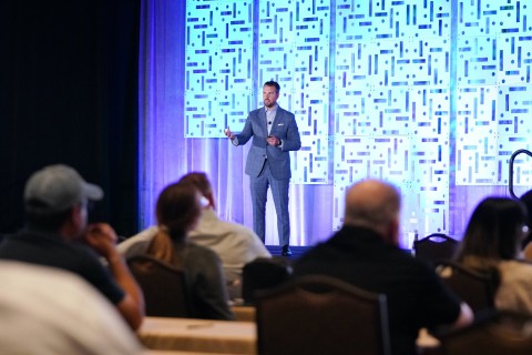 Vice President of Clinical Services and Development Alexander Smith, O.D., speaks at National Vision’s Eastern CE Symposium event in Orlando, Florida. (Photo: Business Wire)
