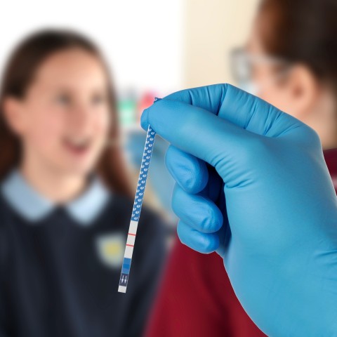original New COVID-19 saliva test makes testing far easier for all ages. How it works: A swab is used to collect the saliva sample from the inside of the lower cheek, which is then mixed with a reagent buffer that has been pre-added to the collection tube in order to release the virus. The screening test is performed by inserting the tip of the VSS-GP test strip into the sample, providing a positive or negative result at 20 minutes. No instrumentation is required. The test uses gold immunonanoparticle technology to enable the visual detection of bound antigen via a control line and a red line on the test strip when a saliva sample is positive for the SARS-CoV-2 antigen. (Photo: Business Wire)