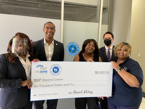 Beyond Careers of Missouri City, Texas, received a $6,000 Partnership Grant Program check. (L to R): LaCarsha Babers and Brandon Perry, Hancock Whitney Bank; Beyond Careers Executive Director Barbara Davis, Advisory Board Member Alexander Obregon and Board President Joan Wills. (Photo: Business Wire)