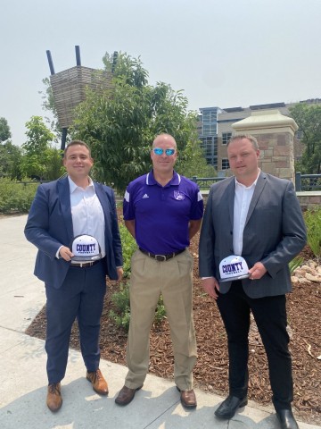 Castle Rock Autoplex Donates $50,000 To Douglas County High School Football Program. Pictured: Jose Medina, Coach Eric Rice, and Travis Van Spronsen (Photo: Business Wire)