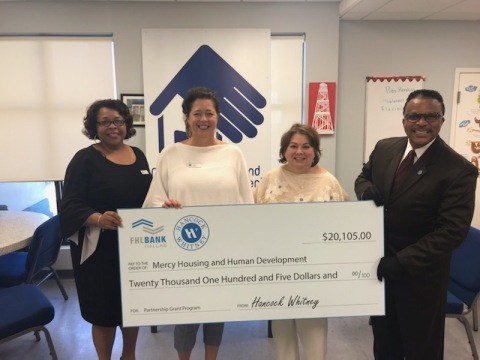 From left to right: Stephanie Johnson and Laurie Godfrey, both with Hancock Whitney, stand with Julie Egressy, executive director of Mercy Housing and Human Development, and Anthony Montgomery of Hancock Whitney, during a recent check presentation to the Gulfport, Mississippi, nonprofit. (Photo: Business Wire)