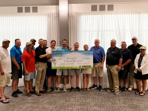 EMCOR in Greater Boston presented a $10,000 check to The Jimmy Fund during ceremonies at the EMCOR Greater Boston 13th Annual Golf Tournament Invitational held Monday, August 9th at Blue Hill Country Club, Canton, MA. David Bolduc, President, EMCOR Services Northeast, Robert Gallagher, President and CEO, J.C. Higgins Corp., Tom Coates, VP and General Manager, Building Technology Engineers, Inc., along with event participants, presented the check. (Photo: Business Wire)