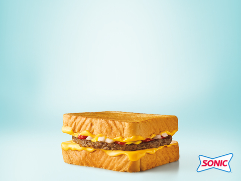 The SONIC® Grilled Cheese Burger starts with SONIC’s famous grilled cheese sandwich on buttery Texas Toast, adding in a perfectly seasoned 100% pure beef patty, mustard, ketchup, and diced onions. (Photo: Business Wire)