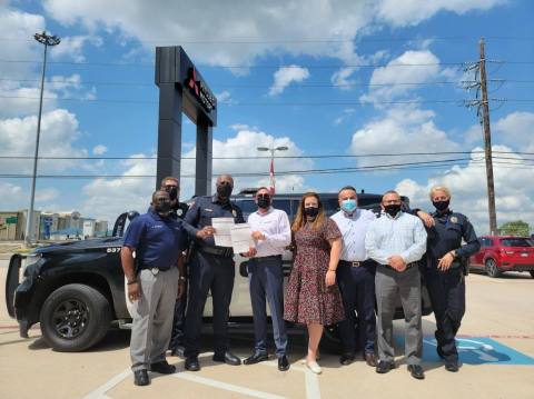 original Foundation 45 Mitsubishi presents over $4000 to the Spring ISD Police Department for their Change Makers program. The money will help with student leadership and literacy initiatives, as well as their Blue Santa program. (Photo: Business Wire)