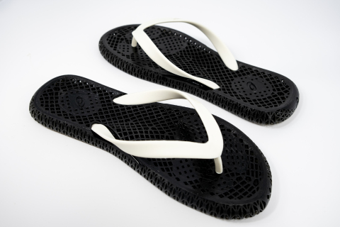3D printed flip flops designed with LuxGen, generative design software, and 3D printed at LuxCreo's Smart Factory. Flip flop size and arch height are matched to customer foot scan at ASICS FUTURE EXPERIENCE LAB. (Photo: Business Wire)