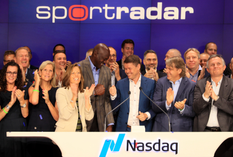 NEW YORK, NY – September 14, 2021: (Front, Left-to-Right) Investor Michael Jordan, Founder and CEO Carsten Koerl, and investor Todd Boehly are surrounded by Sportradar employees as they ring the Nasdaq opening bell in celebration of the launch of the company’s IPO on September 14, 2021 in New York City. (Photo: Business Wire)