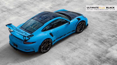 XPEL’s ULTIMATE PLUS™ BLACK provides deep black gloss accents to a previously monochromatic blue Porsche. (Photo: Business Wire)