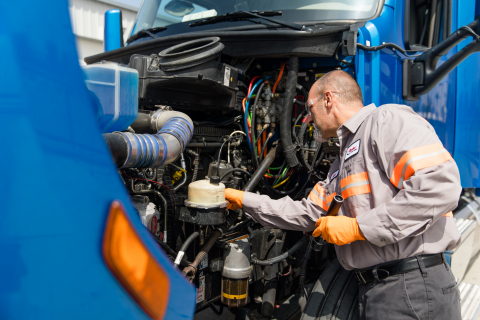 A Ryder technician inspects an Embark autonomous Class 8 tractor in Riverside, Calif. Ryder will provide maintenance, yard operations, and fleet management to support a seamless coast-to-coast autonomous network for Embark fleet partners. (Photo: Business Wire)