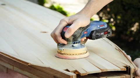 Bosch’s orbit sanders go cordless, featuring a balanced palm-grip design and delivering fast, efficient sanding (Photo: Business Wire)