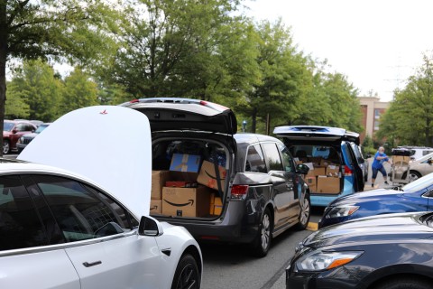 NWFCU Foundation and Northwest employees load trunks full of school supplies for delivery (Photo: Business Wire)