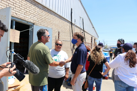 Andy Kopplin, Greater New Orleans Foundation CEO and president (right), shakes hands with the team at the Ward Seven Citizens Center as they work with the Helio Foundation in Chauvin, Louisiana, during the Foundation's recent relief trip to the hurricane-impacted region. (Photo: Business Wire)