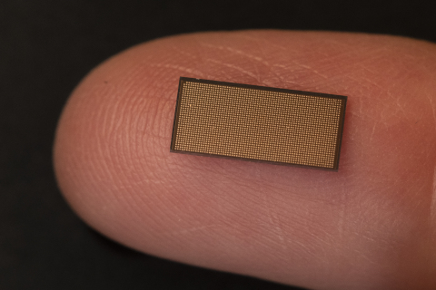 A photo shows Intel’s Loihi 2 neuromorphic chip on the tip of a finger. Loihi 2 is Intel's second-generation neuromorphic research chip. It supports new classes of neuro-inspired algorithms and applications, while providing faster processing, greater resource density and improved energy efficiency. It was introduced by Intel in September 2021. (Credit: Walden Kirsch/Intel Corporation)