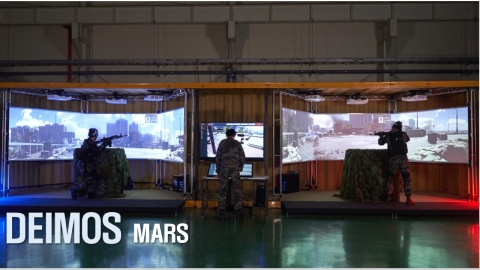 Next-generation Metaverse-based military training system DEIMOS product line MARS. The DEIMOS MARS was developed by OPTIMUS SYSTEM, a Korean developer and supplier of military training simulators, with the R & DB Foundation of the Korea Military Academy in order to localize the military drill simulator and build scientific training systems more effective and optimized for real war conditions. The simulator provides a new concept of shooting drill environment based on a spatial synchronization technology, which precisely corrects and matches the physical location and direction of users and objects to a world of virtual reality from the trainee’s point of view. Setting up a Metaverse military drill environment where trainees can react to each other as in real war conditions, DEIMOS enables interactive combat, precision shooting without distorted target lines, and precision hit recognition. (Photo: Business Wire)