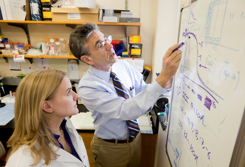 Robert Lefkowitz, MD speaks with a colleague. (Credit: Duke University Medical Center)