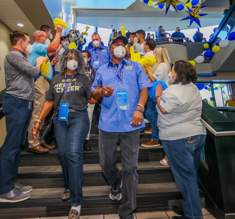 J.B. Hunt Intermodal driver Reginald Miller participates in the Million Mile Walk of Fame at company headquarters in Lowell after achieving two million safe miles driven for the company. (Photo: Business Wire)