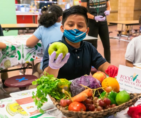 Students sample fresh produce at a taste test hosted by the Food Bank of South Jersey and Wellness in the Schools as part of Full Futures: A School Nutrition Partnership. Campbell Soup Company is investing $5 million over five years and working with the Camden City School District and a number of non-profit and corporate partners to advance school nutrition. (Photo: Business Wire)