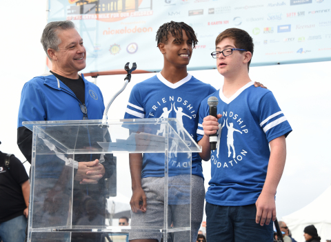 Michael Greenberg joins Friendship Foundation buddies Marcus and Owen at the Skechers Pier to Pier Friendship Walk. The event has raised more than $17 million to support children with special needs and education. Photo credit: Gregg DeGuire, Getty Images
